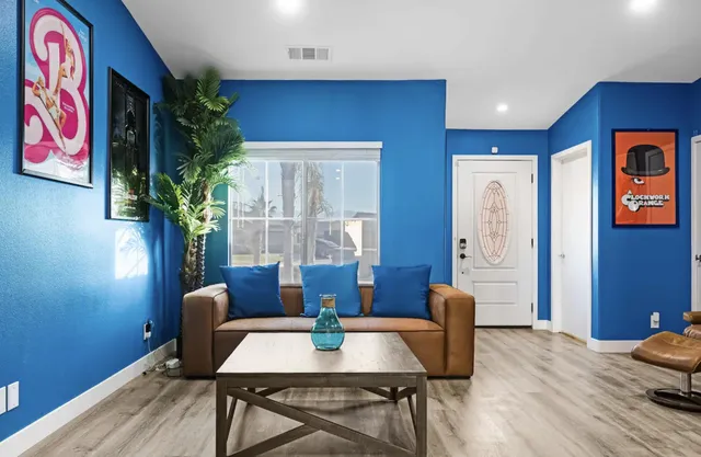 a workspace with wooden floor and furniture