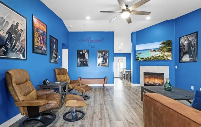 a kitchen with kitchen island granite countertop a sink cabinets and stainless steel appliances
