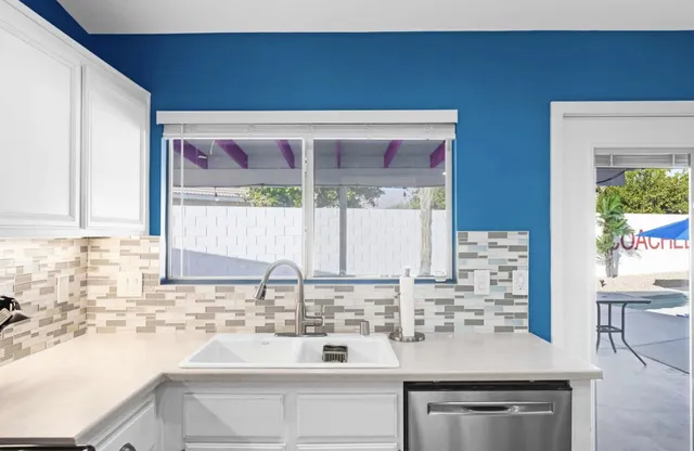 a kitchen with stainless steel appliances a refrigerator stove and microwave