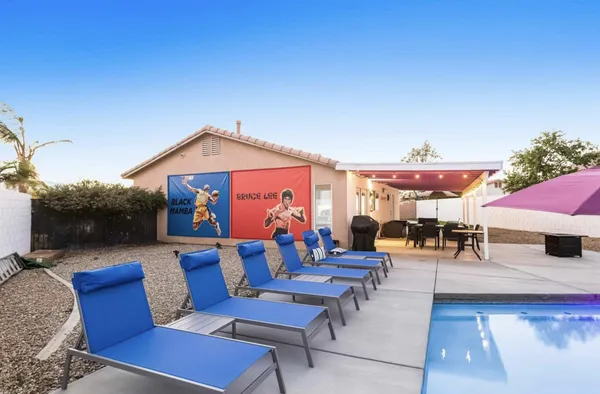 a outdoor space with patio couches and a fireplace