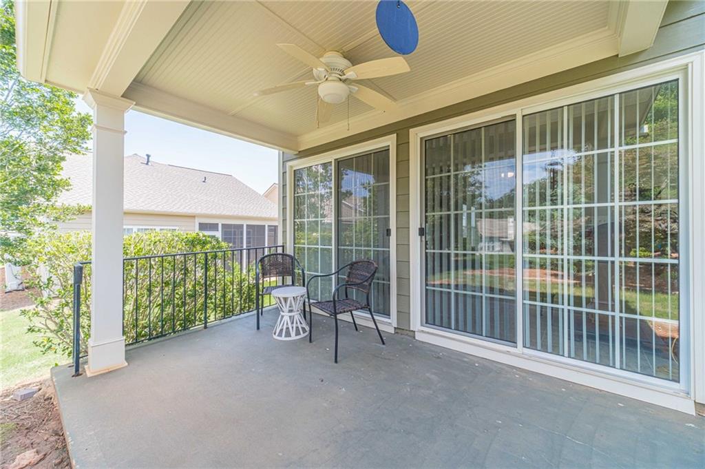 6260 Brookside Lane Hoschton, GA 30548 - Photo 13 of 59 a view of a room with wooden floor and iron stairs