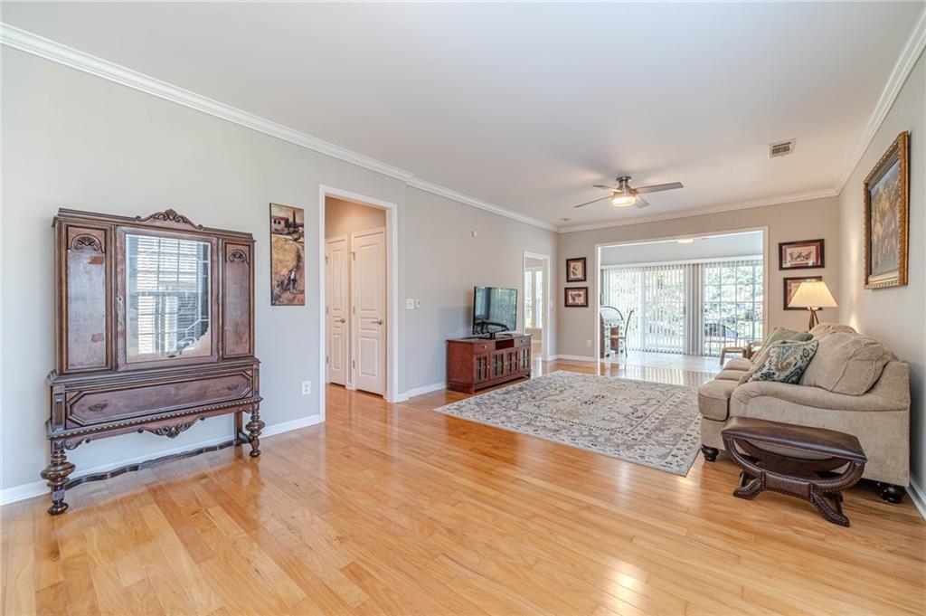 6260 Brookside Lane Hoschton, GA 30548 - Photo 15 of 59 a living room with furniture window and wooden floor