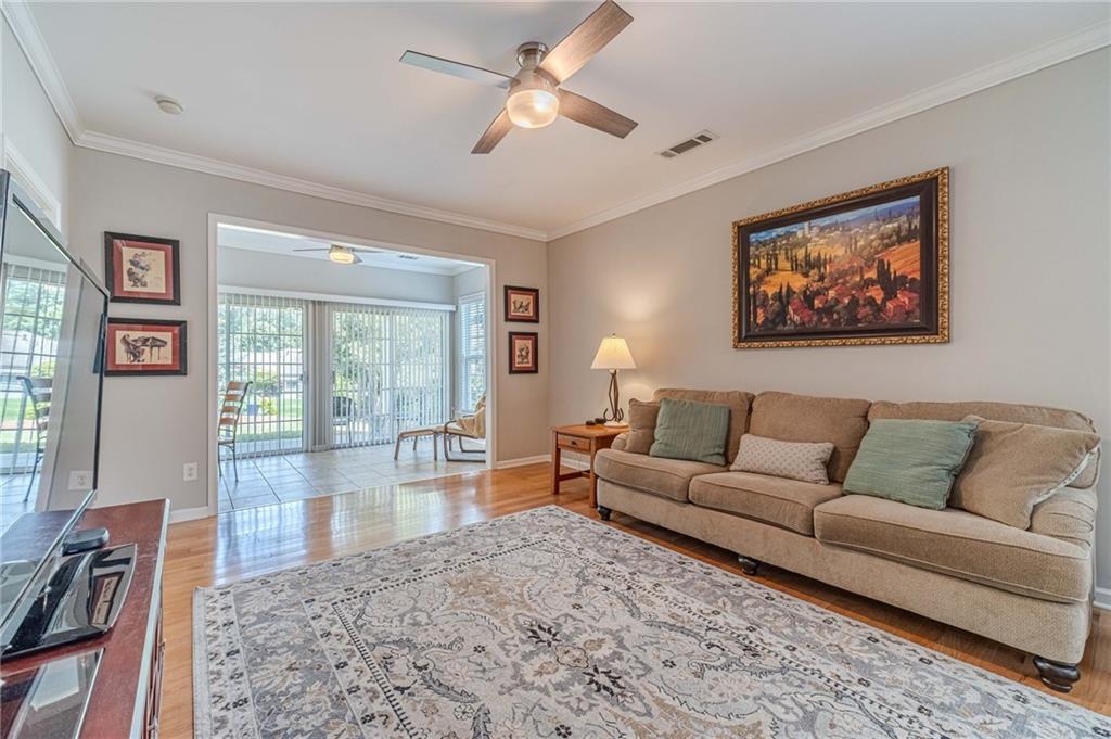 6260 Brookside Lane Hoschton, GA 30548 - Photo 17 of 59 a living room with furniture and a large window