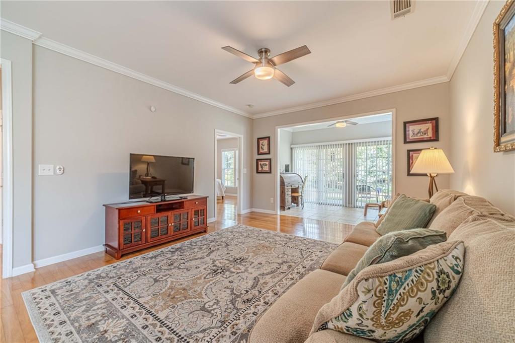 6260 Brookside Lane Hoschton, GA 30548 - Photo 18 of 59 a living room with furniture and a flat screen tv