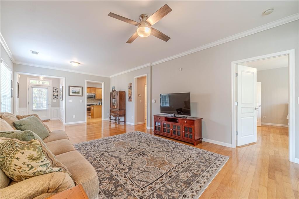 6260 Brookside Lane Hoschton, GA 30548 - Photo 19 of 59 a living room with furniture and a flat screen tv