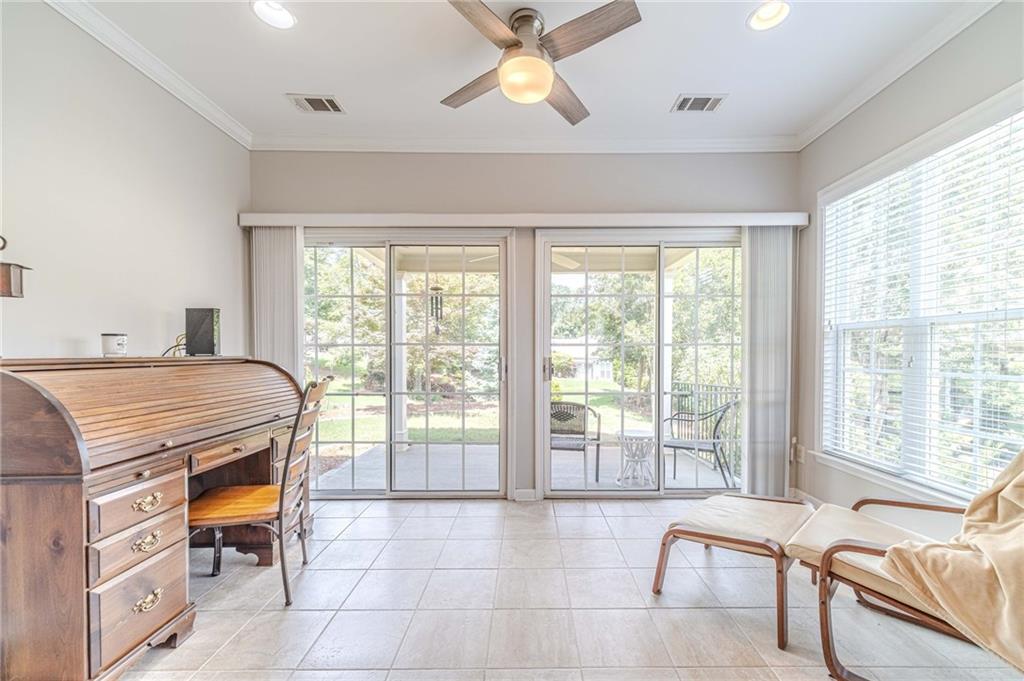 6260 Brookside Lane Hoschton, GA 30548 - Photo 23 of 59 a bedroom with furniture and large windows