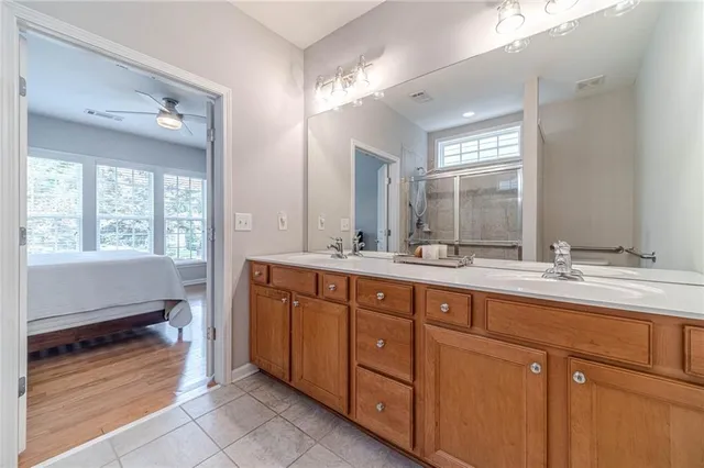 a bathroom with a sink a toilet and shower curtain