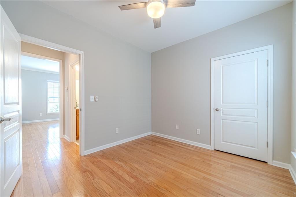 6260 Brookside Lane Hoschton, GA 30548 - Photo 33 of 59 a view of empty room with wooden floor