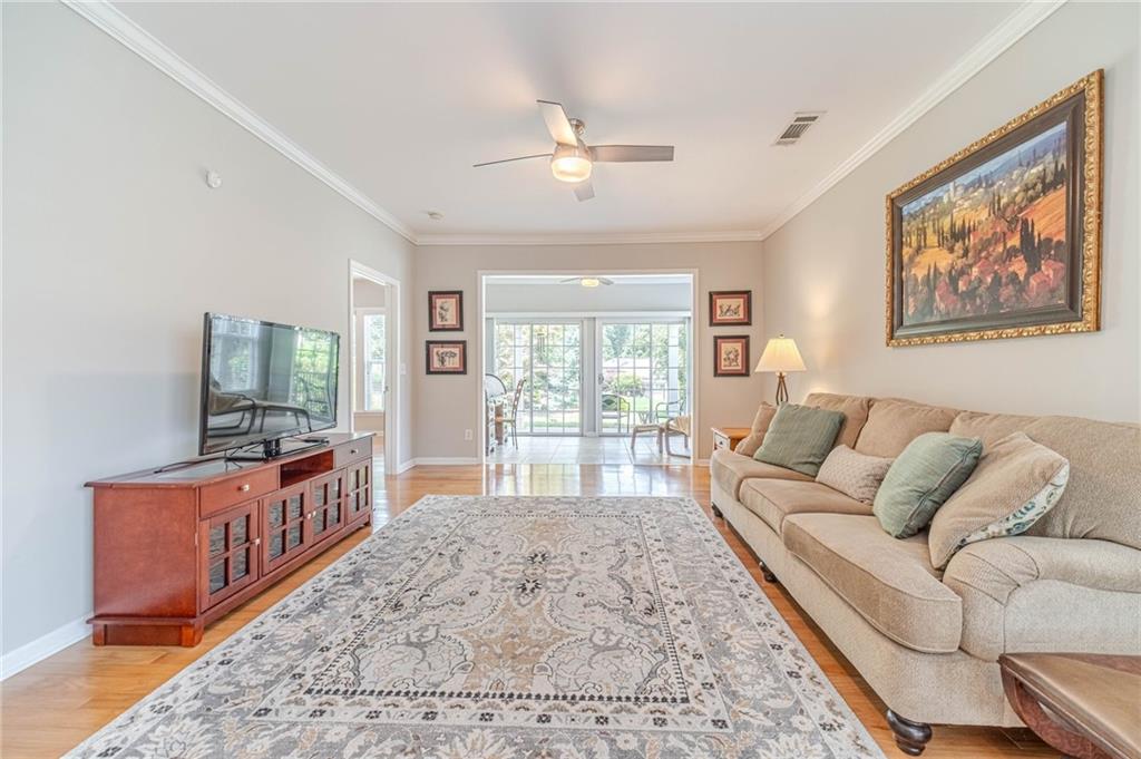 6260 Brookside Lane Hoschton, GA 30548 - Photo 36 of 59 a living room with furniture and a large window