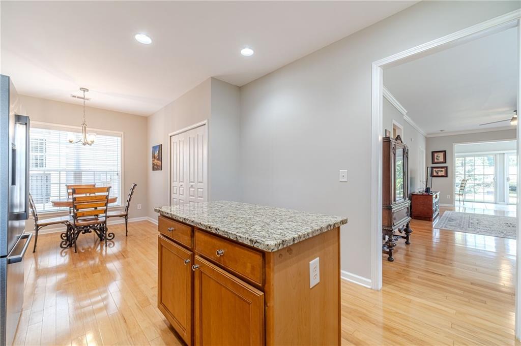6260 Brookside Lane Hoschton, GA 30548 - Photo 43 of 59 a view of kitchen with granite countertop window and dining table