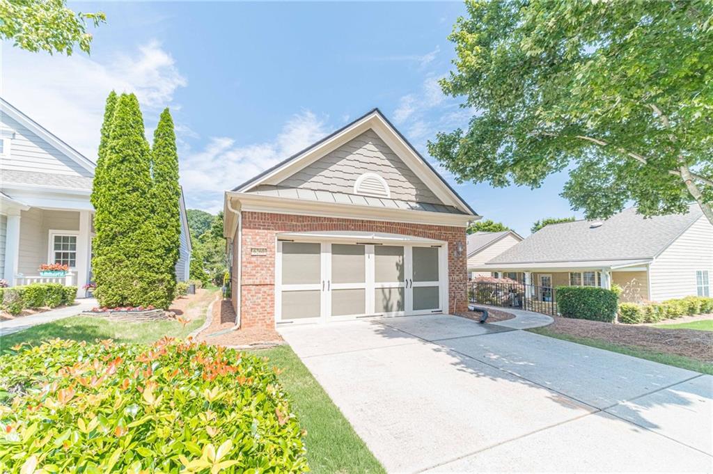 6260 Brookside Lane Hoschton, GA 30548 - Photo 5 of 59 front view of a house with a garden