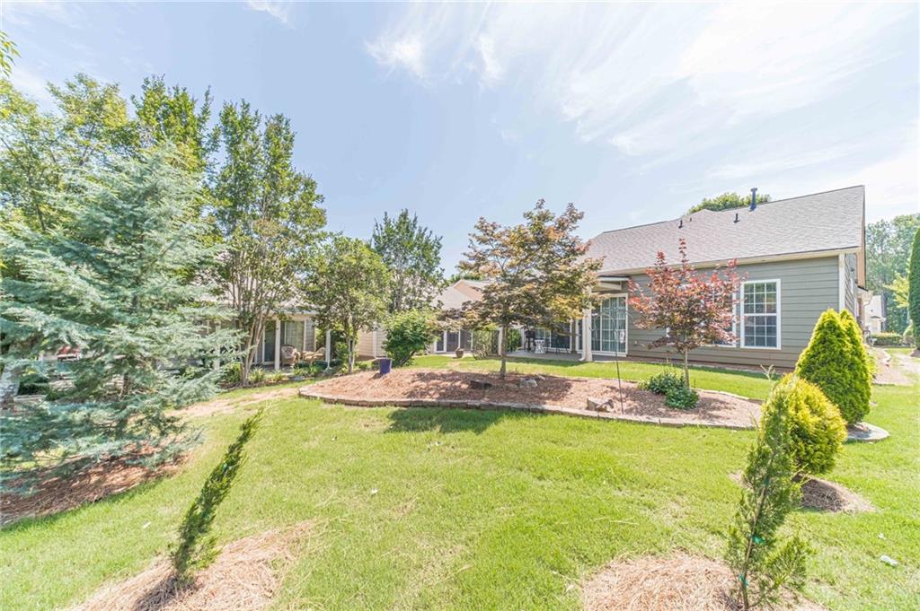 6260 Brookside Lane Hoschton, GA 30548 - Photo 9 of 59 a view of swimming pool of the house with yard and outdoor seating