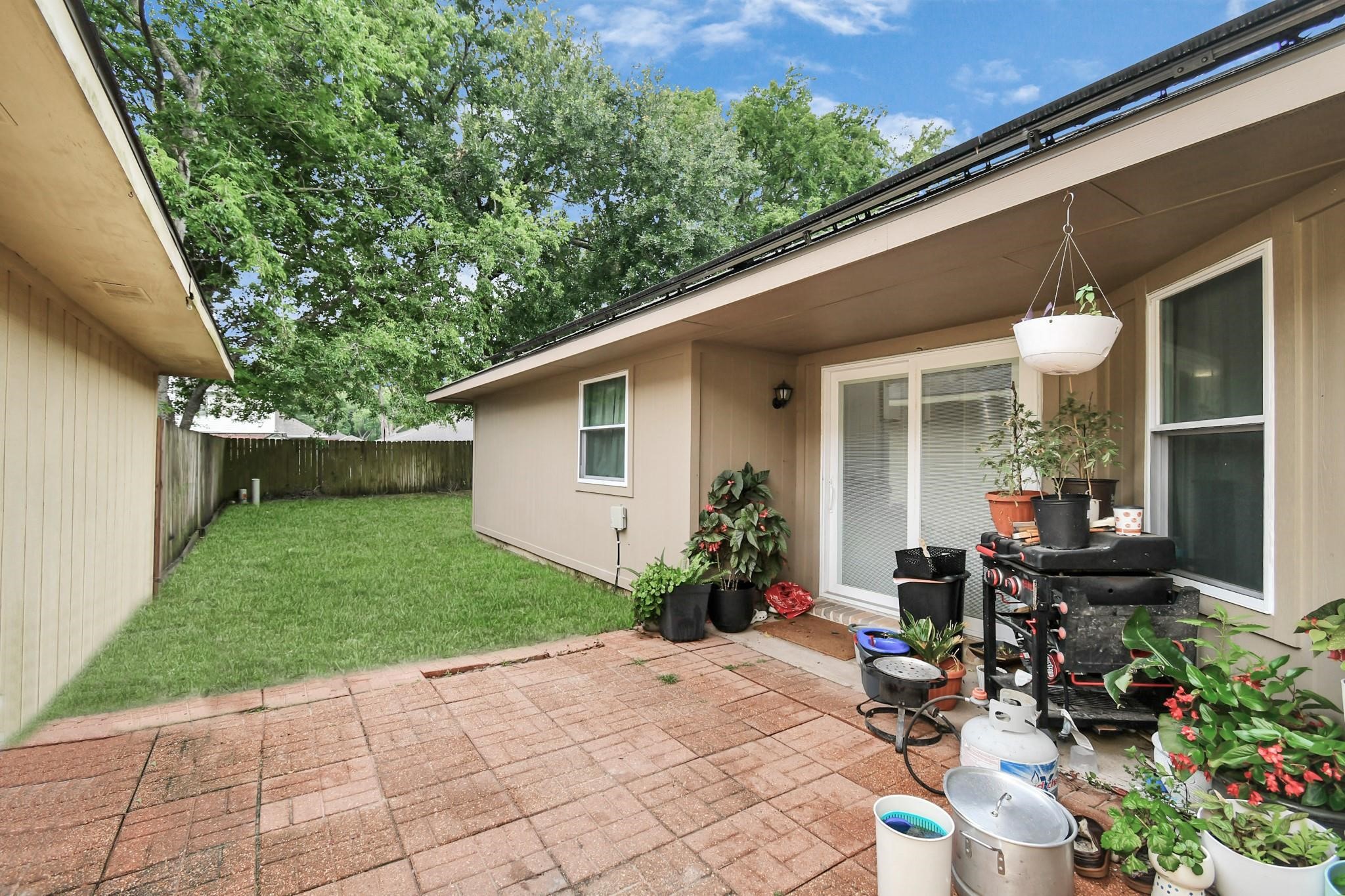 23507 Tree House Lane Spring, TX 77373 - Photo 12 of 17 a view of backyard with outdoor seating and potted plants