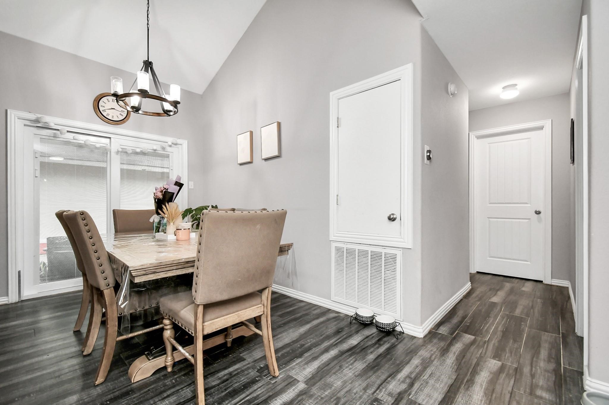 23507 Tree House Lane Spring, TX 77373 - Photo 3 of 17 a view of a dining room with furniture window and wooden floor