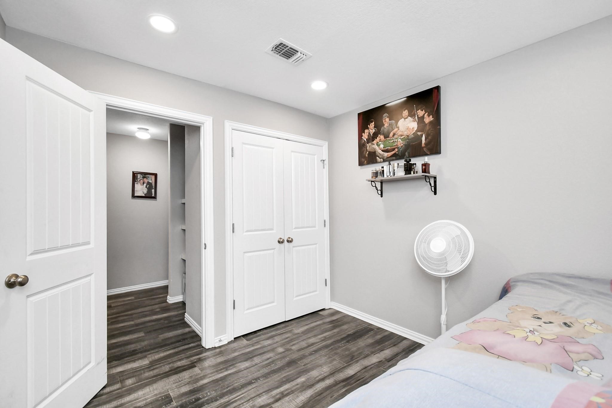 23507 Tree House Lane Spring, TX 77373 - Photo 7 of 17 a view of a livingroom with wooden floor and closet