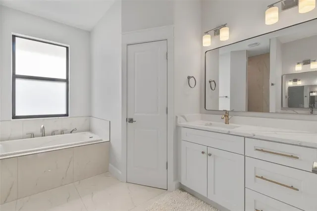 a bathroom with a sink and a bathtub