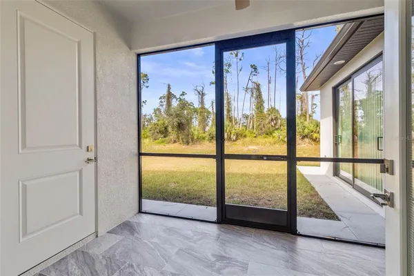 a view of an entryway with wooden floor