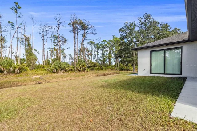 a view of a yard with an trees