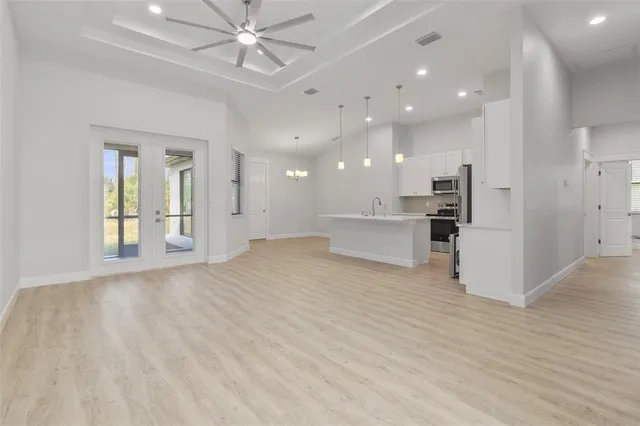 a view of a kitchen with a sink and a stove top oven