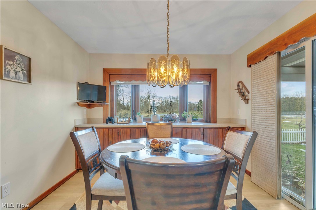 563 North Carpenter Road Brunswick, OH 44212 - Photo 12 of 45 Kitchen with light wood-style floors and a chandelier