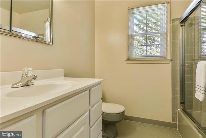 15507 Good Hope Road Silver Spring, MD 20905 - Photo 11 of 30 a bathroom with a sink a toilet and shower