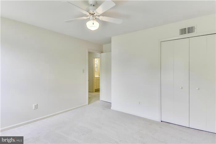 15507 Good Hope Road Silver Spring, MD 20905 - Photo 15 of 30 an empty room with a ceiling fan and a window