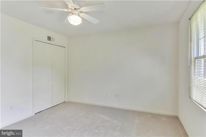 15507 Good Hope Road Silver Spring, MD 20905 - Photo 17 of 30 an empty room with windows and fan