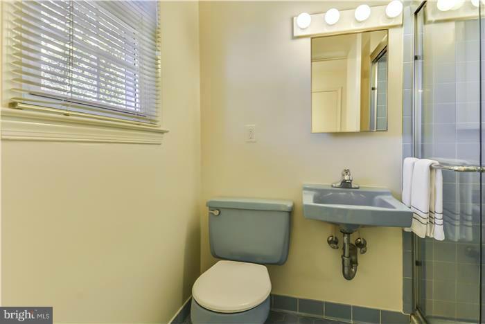 15507 Good Hope Road Silver Spring, MD 20905 - Photo 19 of 30 a bathroom with a toilet sink and mirror