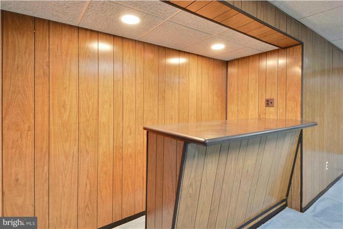 15507 Good Hope Road Silver Spring, MD 20905 - Photo 21 of 30 a view of an empty room with wooden walls