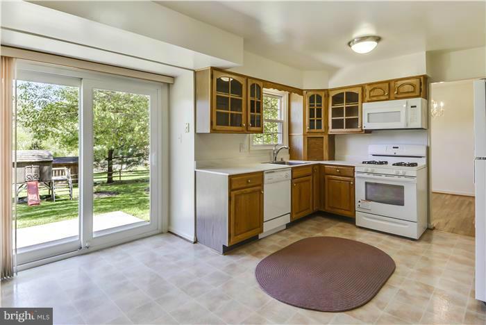 15507 Good Hope Road Silver Spring, MD 20905 - Photo 5 of 30 a kitchen with a stove a sink and a refrigerator