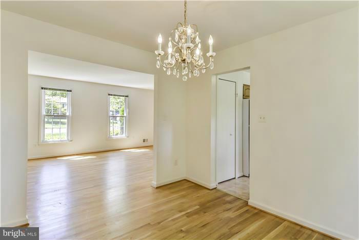 15507 Good Hope Road Silver Spring, MD 20905 - Photo 7 of 30 a view of an empty room with window and wooden floor