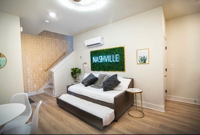 1701 Porter Road, Unit 8 Nashville, TN 37206 - Photo 1 of 17 a living room with furniture and a potted plant