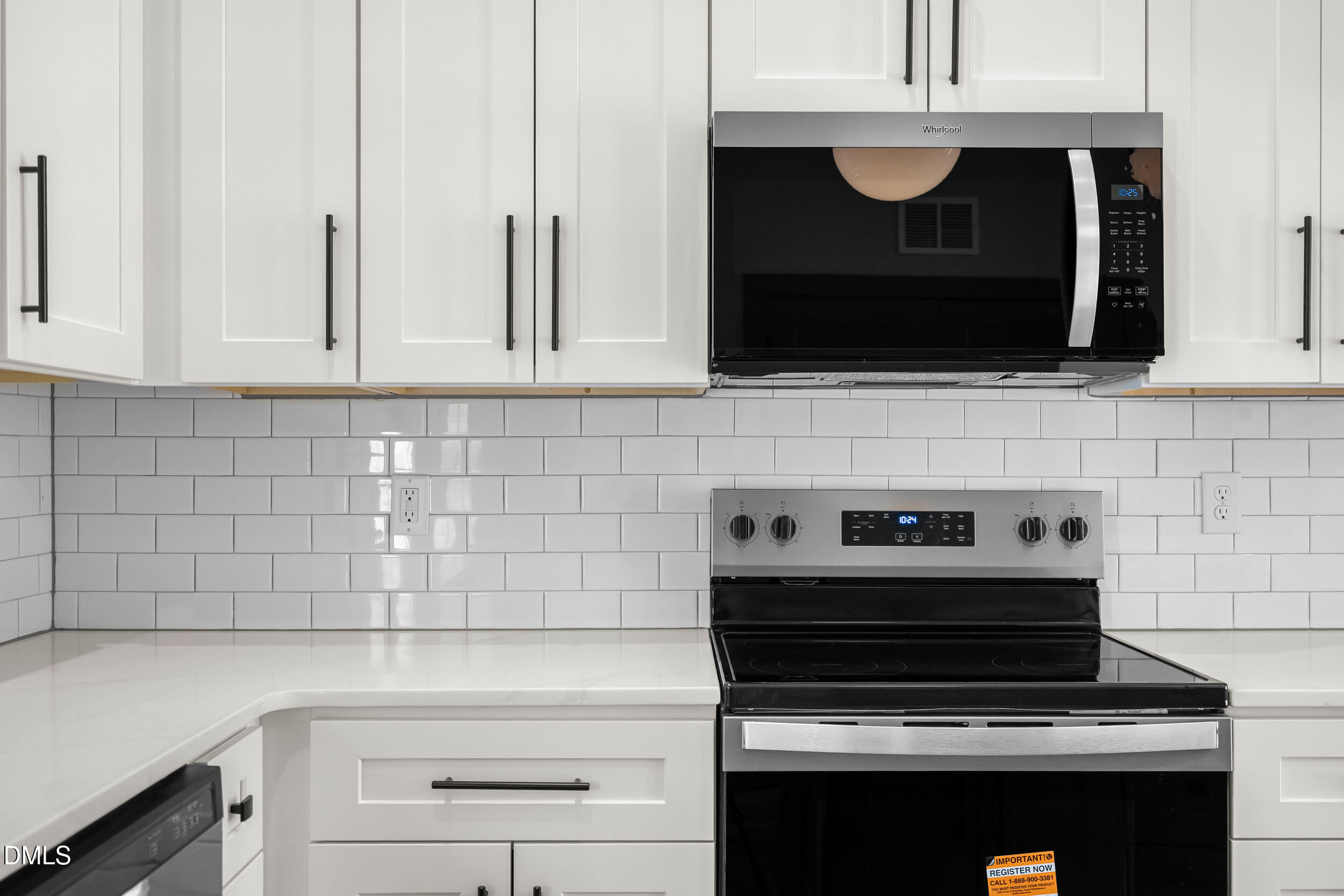 6731 Knightdale-Eagle Rock Road Wendell, NC 27591 - Photo 12 of 25 a kitchen with microwave cabinets and appliances