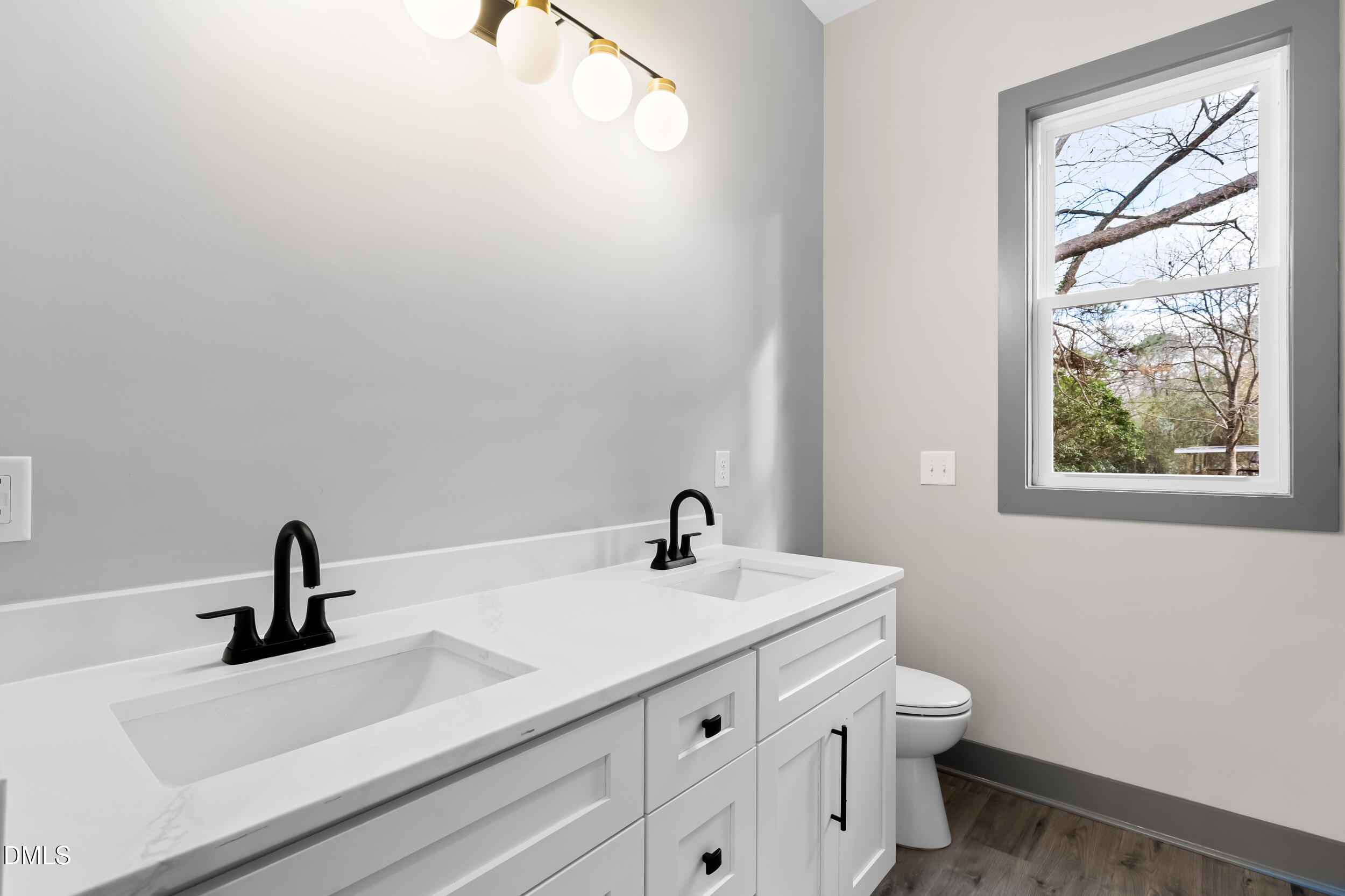 6731 Knightdale-Eagle Rock Road Wendell, NC 27591 - Photo 19 of 25 a bathroom with a sink and a mirror