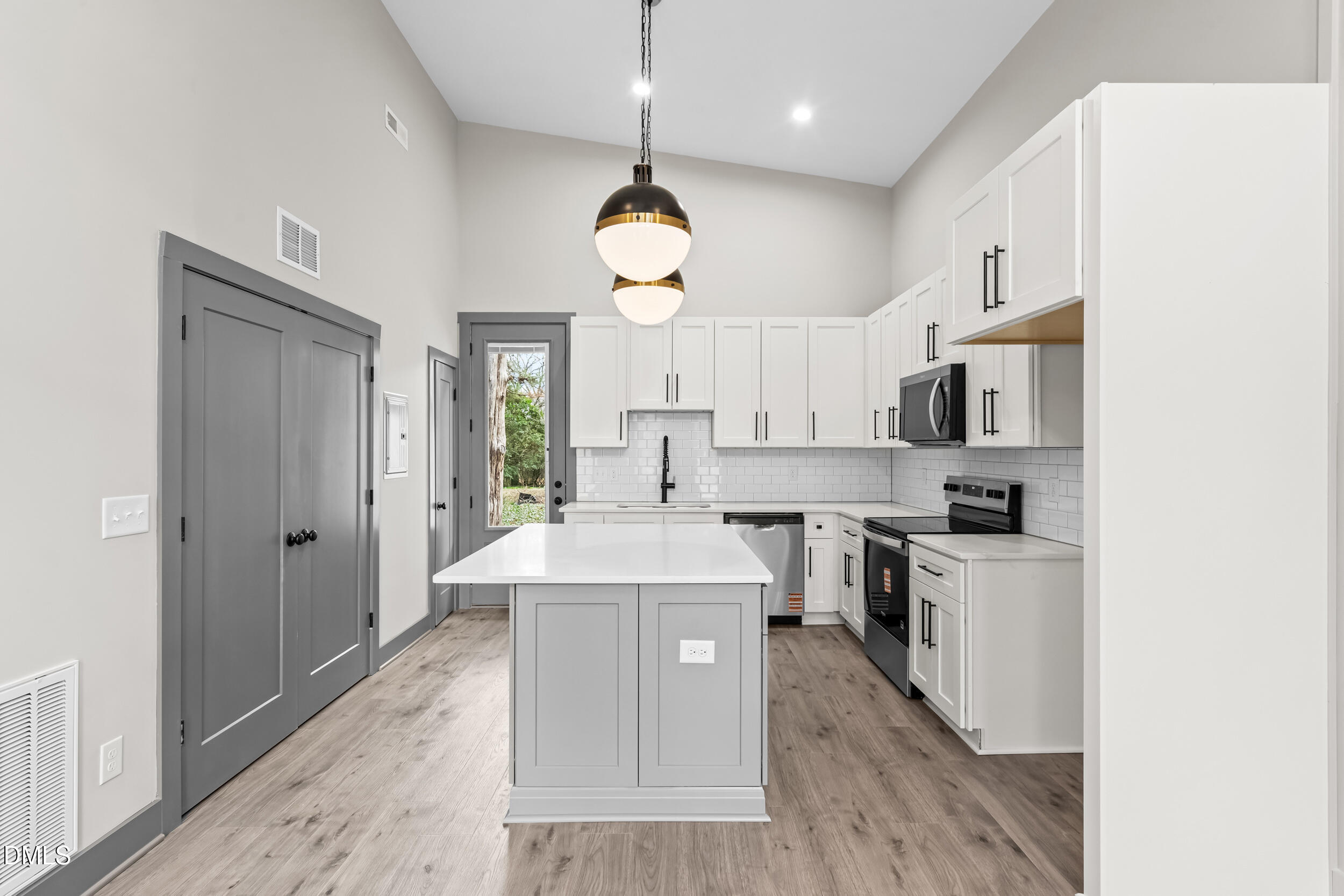 6731 Knightdale-Eagle Rock Road Wendell, NC 27591 - Photo 7 of 25 a kitchen with a stove a sink and a refrigerator