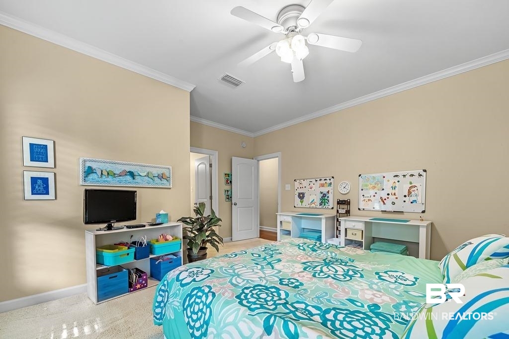 29976 Dolive Ridge Daphne, AL 36527 - Photo 38 of 58 Carpeted bedroom with ornamental molding and ceiling fan