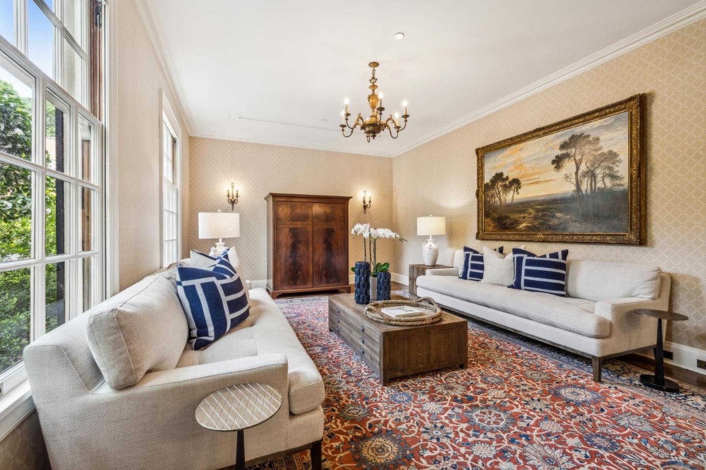 100 Cañada Road Woodside, CA 94062 - Photo 11 of 79 a living room with furniture and a flat screen tv