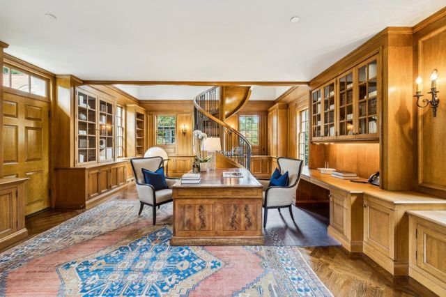 a view of a patio with couches table and chairs and potted plants