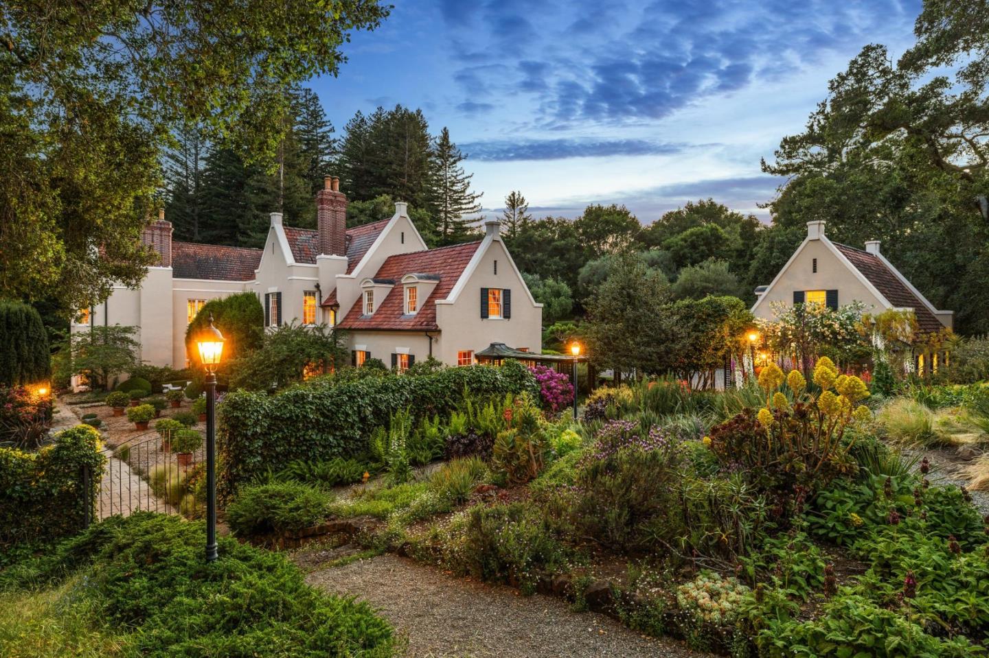 100 Cañada Road Woodside, CA 94062 - Photo 2 of 79 a aerial view of a house with a yard and large trees