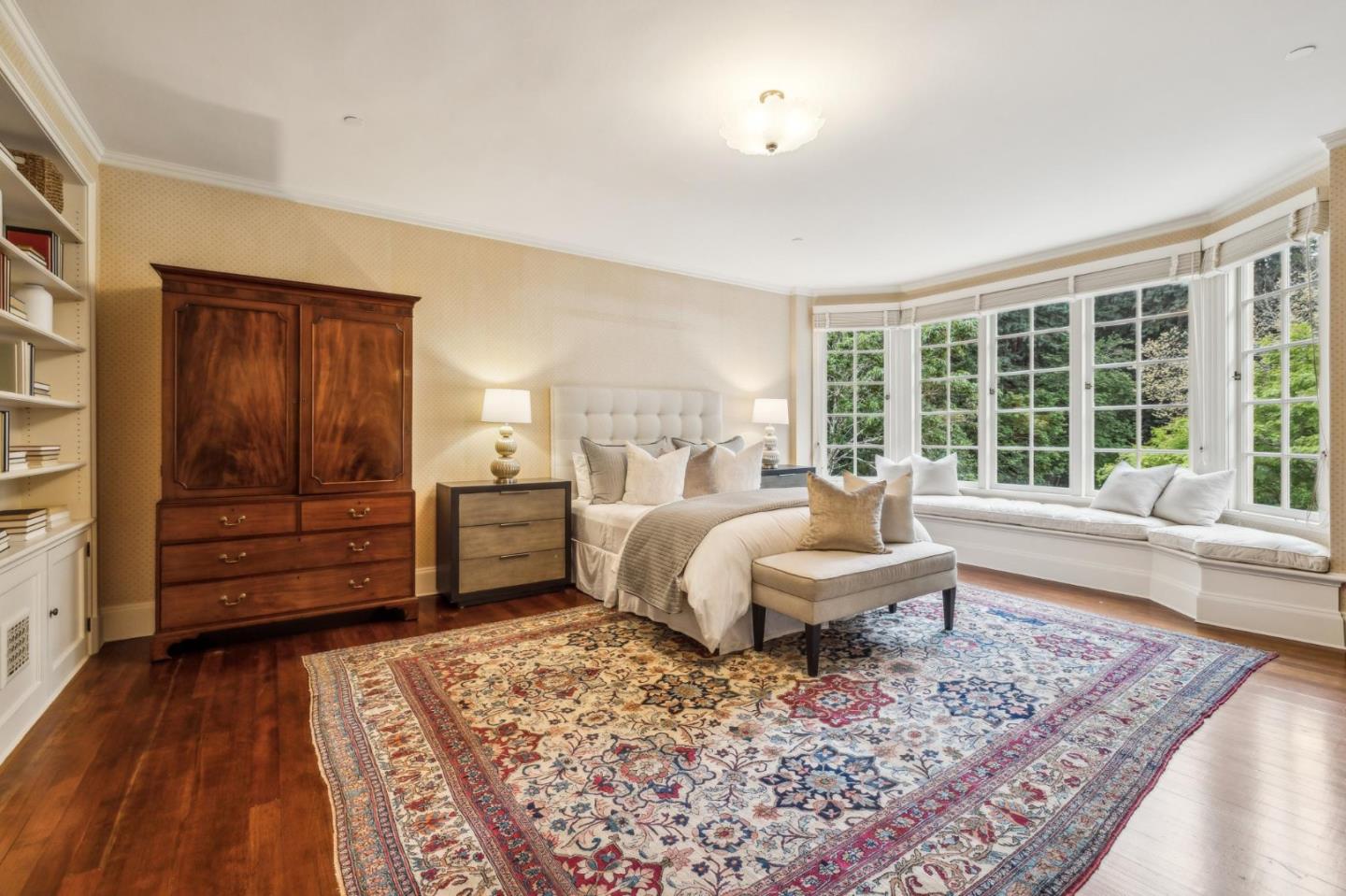 100 Cañada Road Woodside, CA 94062 - Photo 35 of 79 a bedroom with a bed and wooden floor