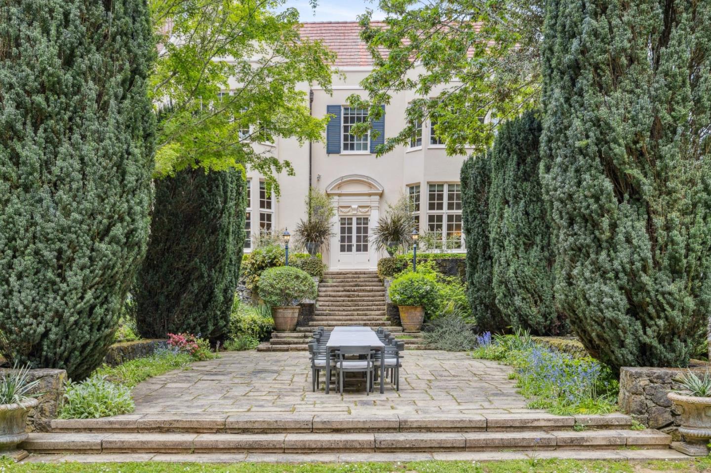 100 Cañada Road Woodside, CA 94062 - Photo 51 of 79 a front view of a house with a yard