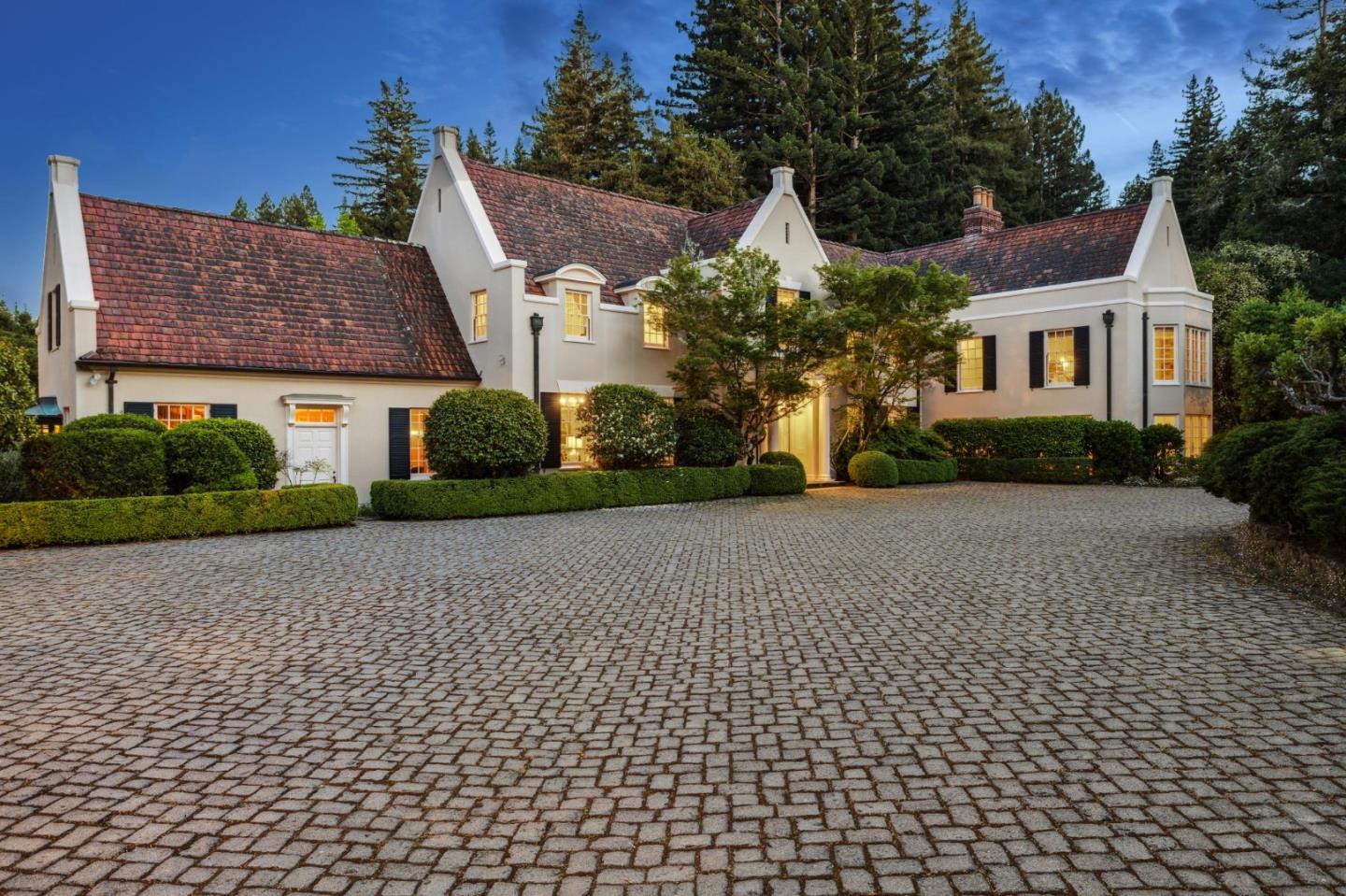 100 Cañada Road Woodside, CA 94062 - Photo 62 of 79 a front view of a house with a yard