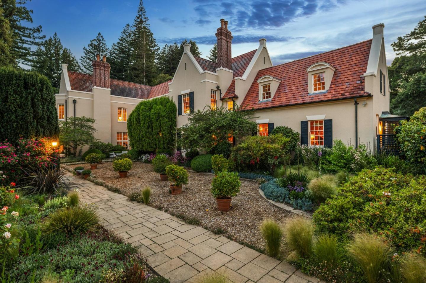 100 Cañada Road Woodside, CA 94062 - Photo 74 of 79 a view of a street with potted plants and more windows