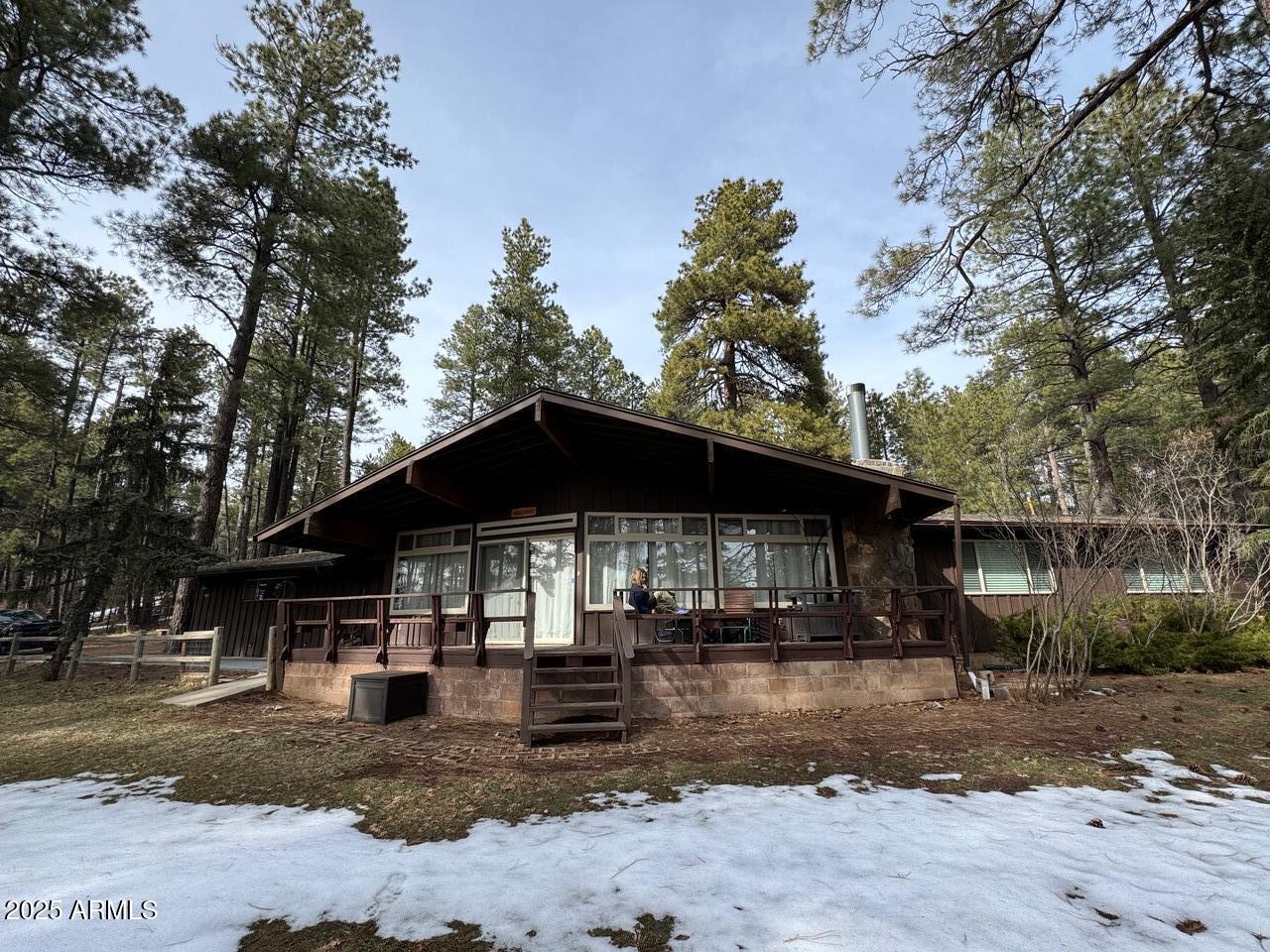 480 Cochise Road Munds Park, AZ 86017 - Photo 2 of 62 a front view of a house with a yard