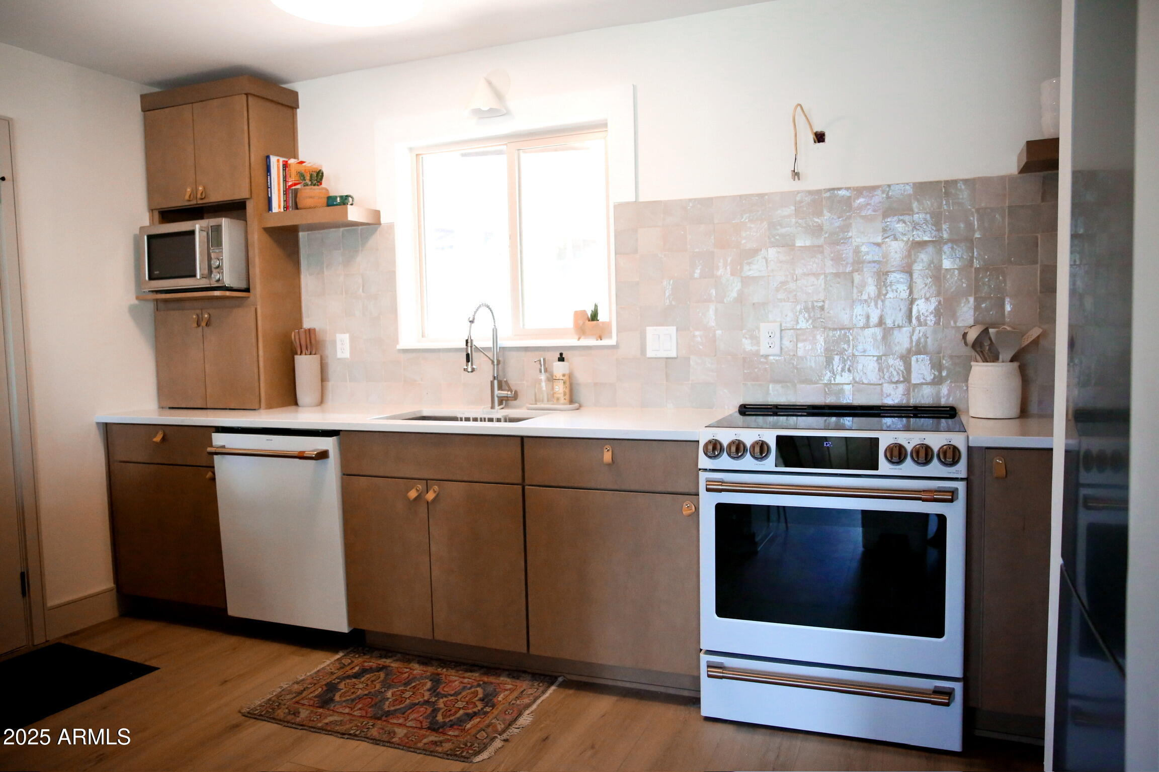 480 Cochise Road Munds Park, AZ 86017 - Photo 25 of 62 a kitchen with stainless steel appliances granite countertop a stove a sink and a refrigerator
