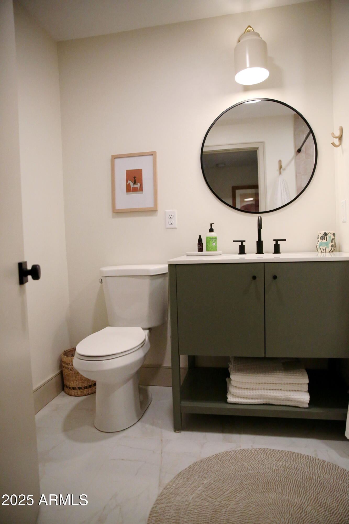480 Cochise Road Munds Park, AZ 86017 - Photo 34 of 62 a bathroom with a toilet a sink and a mirror