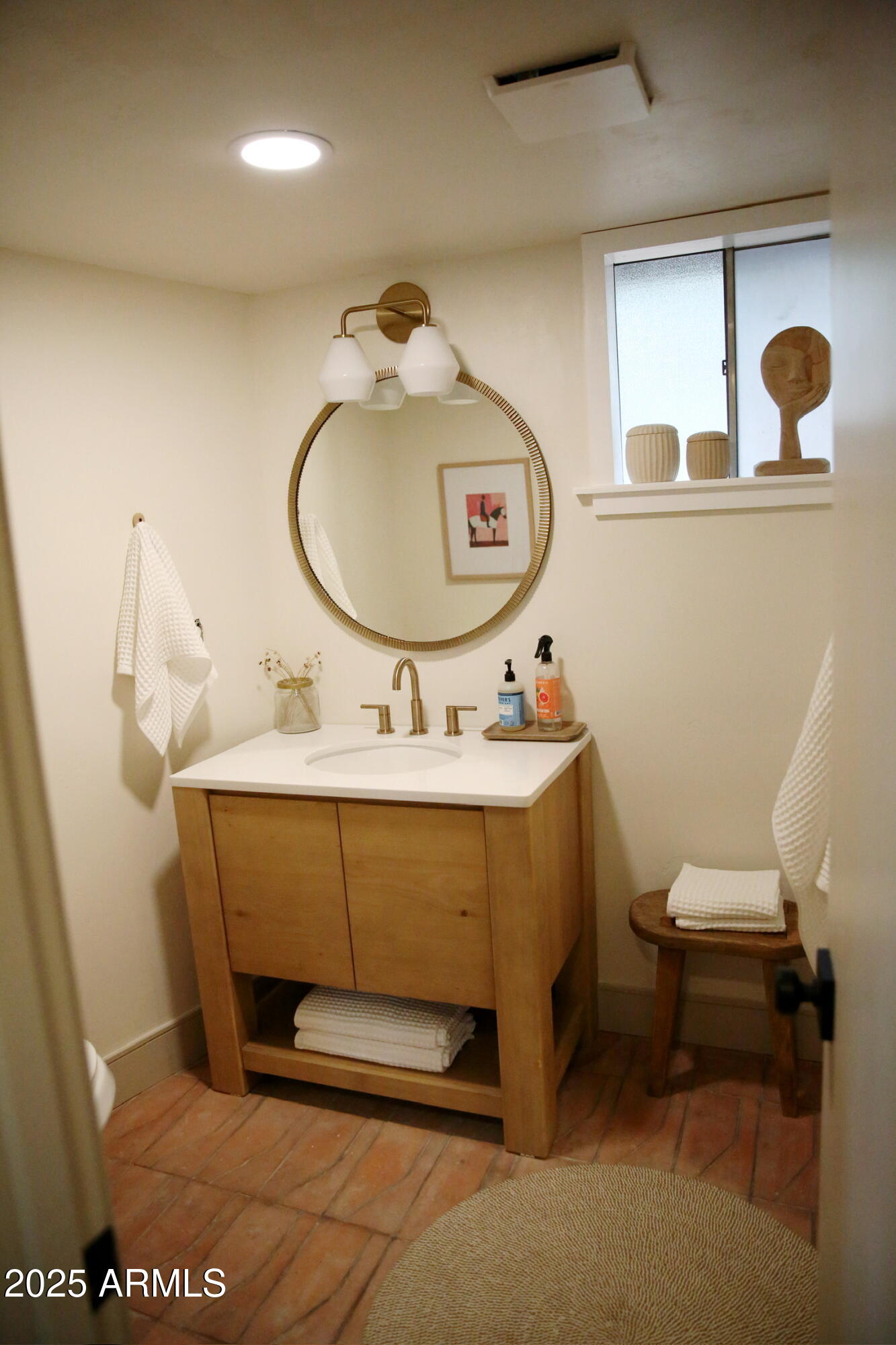 480 Cochise Road Munds Park, AZ 86017 - Photo 38 of 62 a bathroom with a sink mirror and toilet