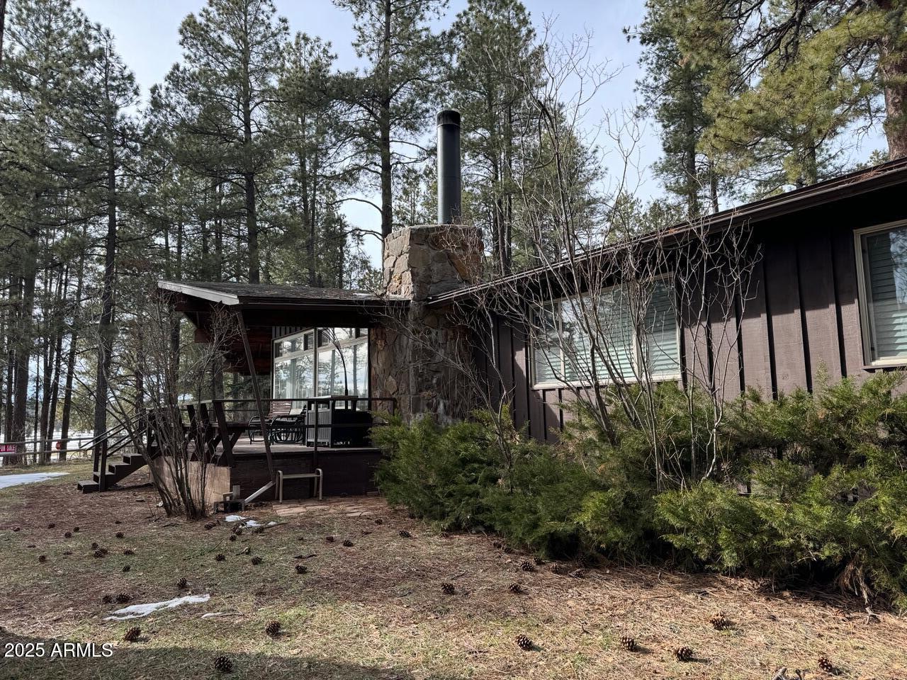 480 Cochise Road Munds Park, AZ 86017 - Photo 5 of 62 a backyard of a house with lots of green space