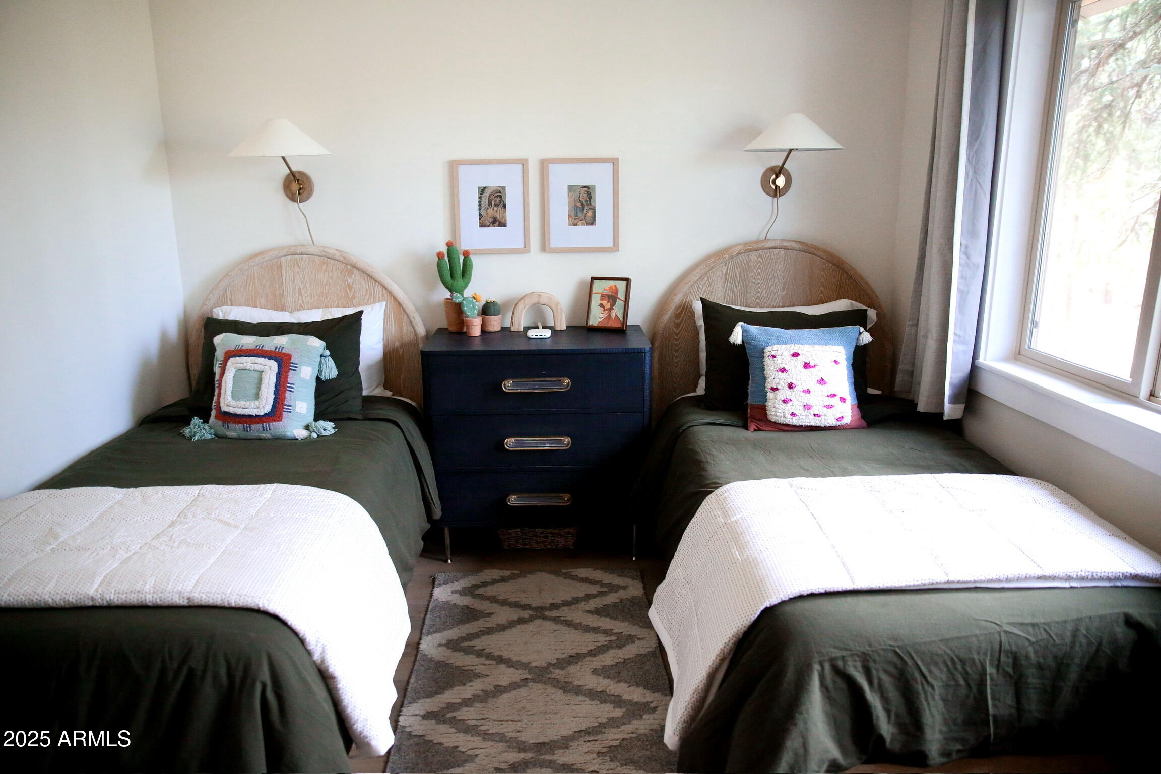 480 Cochise Road Munds Park, AZ 86017 - Photo 55 of 62 a bedroom with a bed and a window