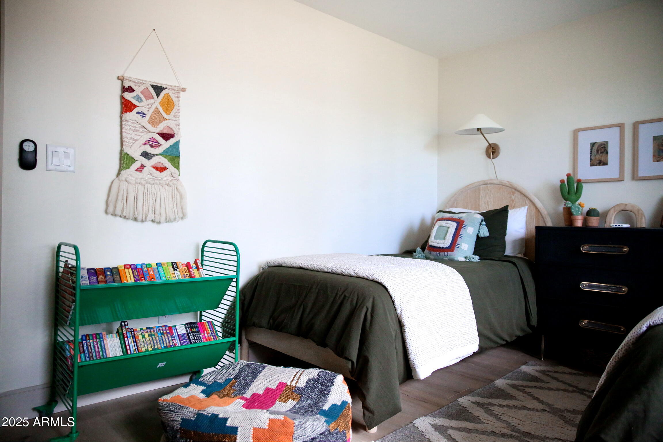 480 Cochise Road Munds Park, AZ 86017 - Photo 56 of 62 a bedroom with a bed and a wooden floor